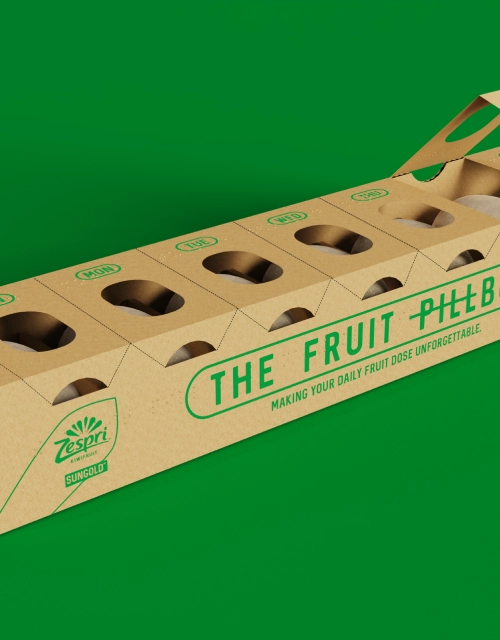 Eco-friendly cardboard pillbox designed for storing individual fruit servings labeled with days of the week
