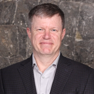 Portrait of Tom Oravez, member of Packfora Leadership Team